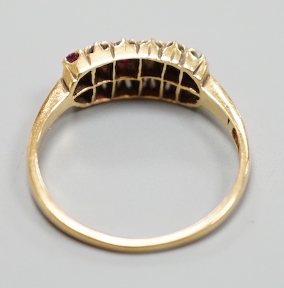 An 18ct, ruby and diamond set two row ring, size P/Q, gross 3.1 grams.